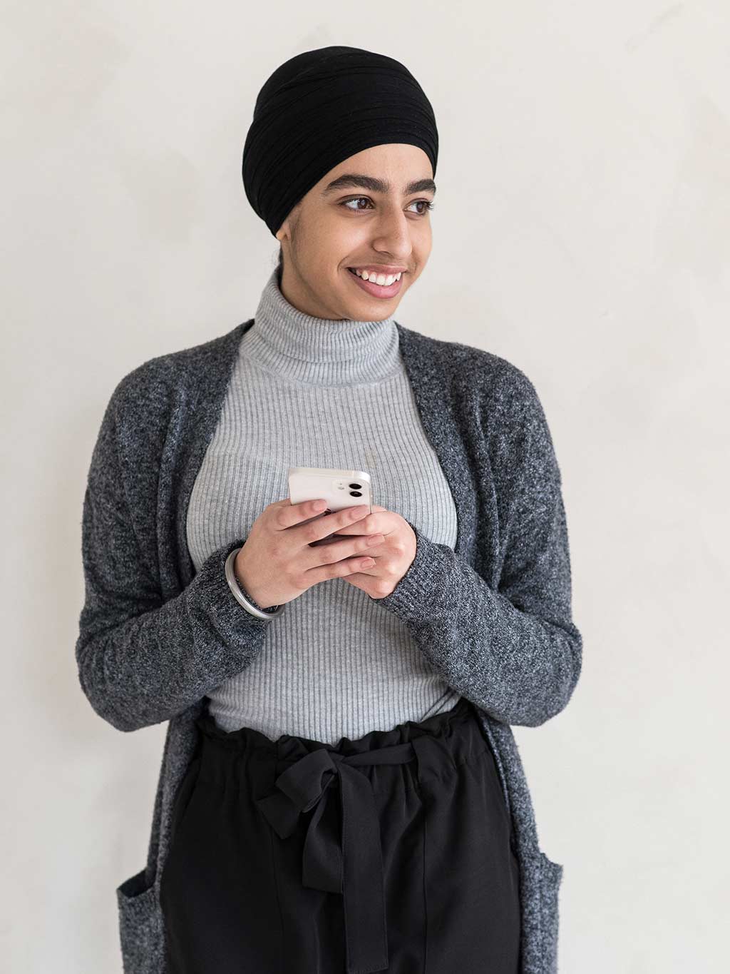 minerva bc smiling woman youth holding cellphone