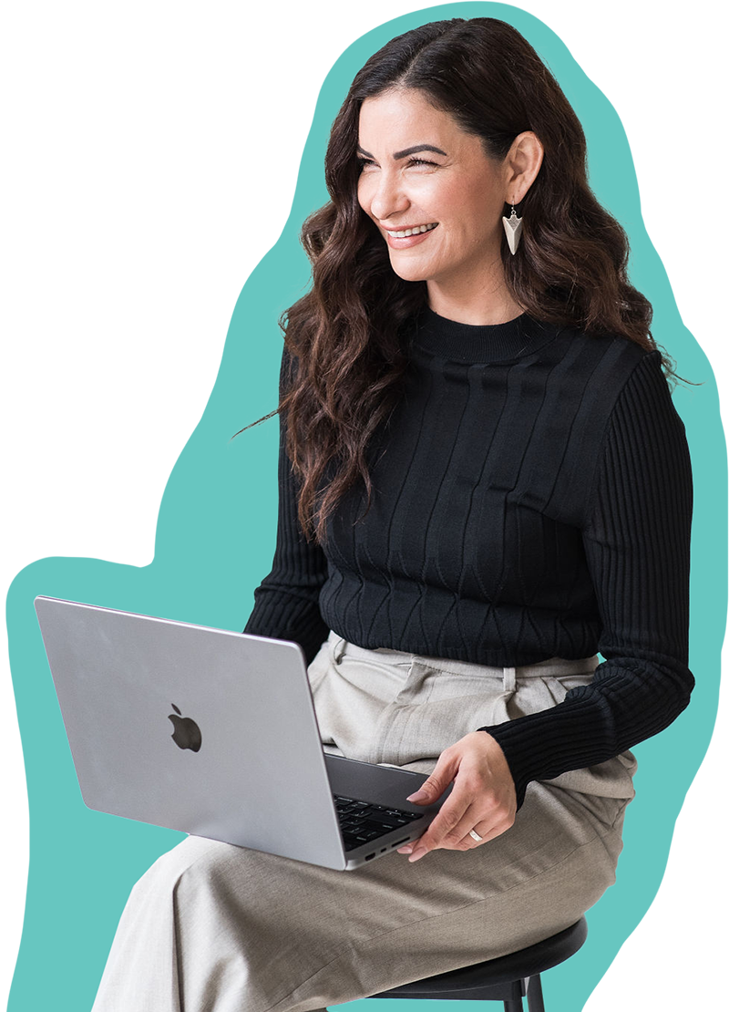 minerva bc smiling women in professional attire holding laptop