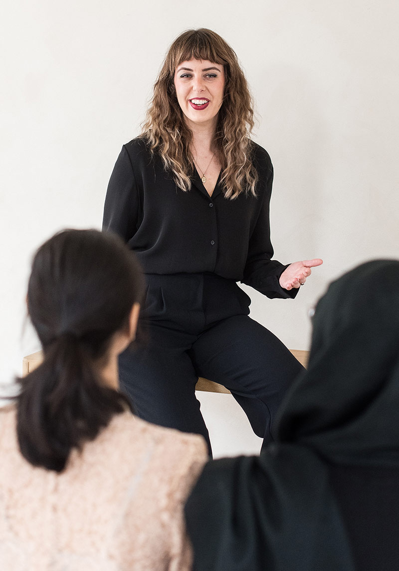 minerva bc woman in business attire presenting