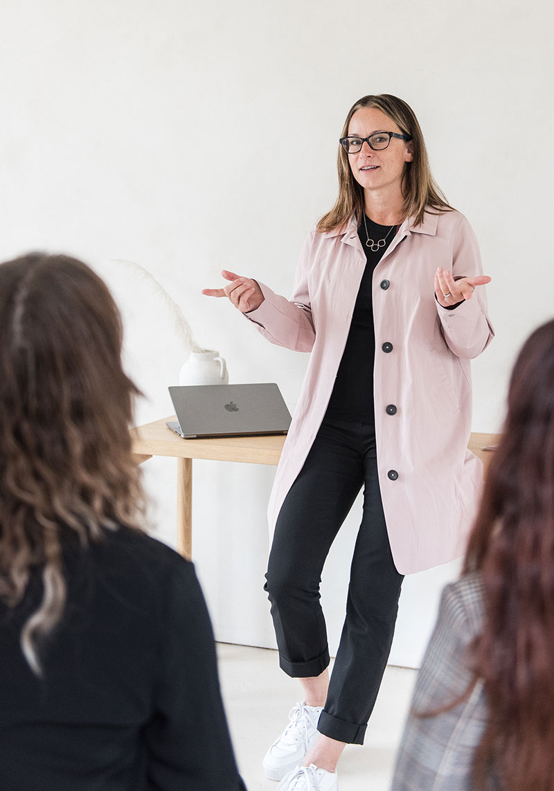 minerva bc woman presenting in front of peers