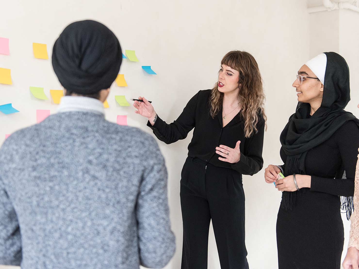 minerva bc women learning together with post its on wall