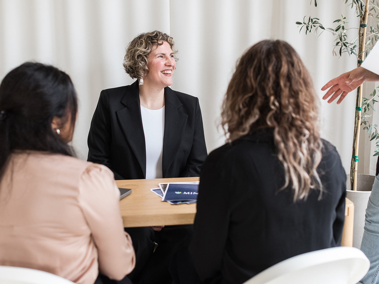 minerva bc women sitting at table smiling